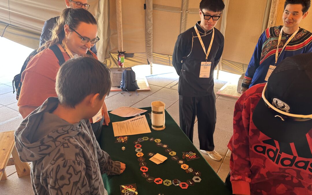 The Frozen Commons: Knowledge Gathering Board Game was presented on March 26, 2025, at the Indigenous Pavilion during the Arctic Science Summit Week (ASSW) 2025 in Boulder.